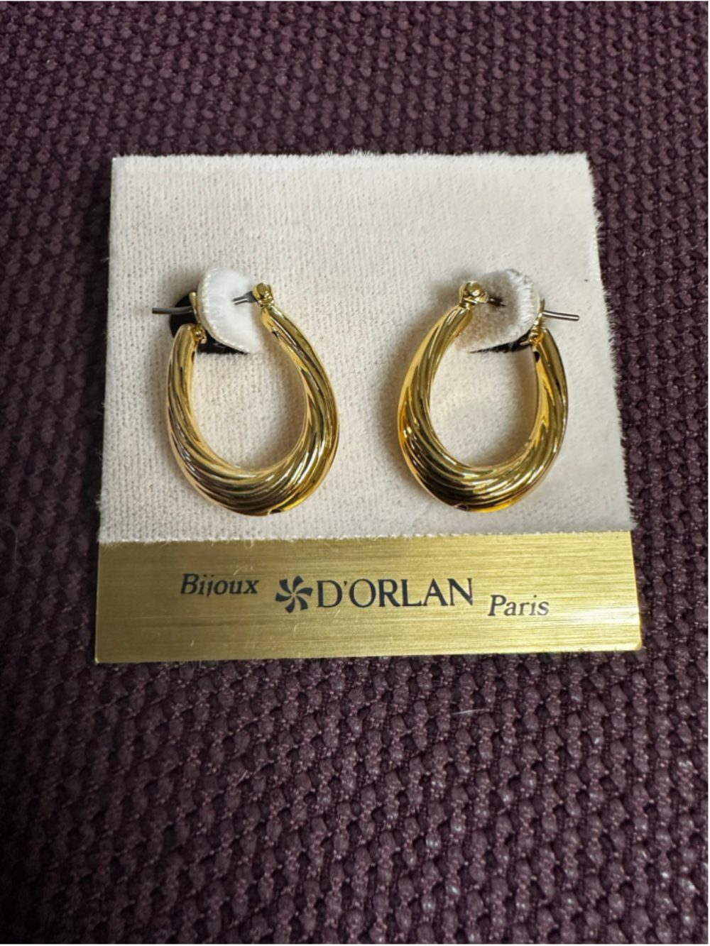 D'Orlan Gold Tone Twisted Hoop Earrings